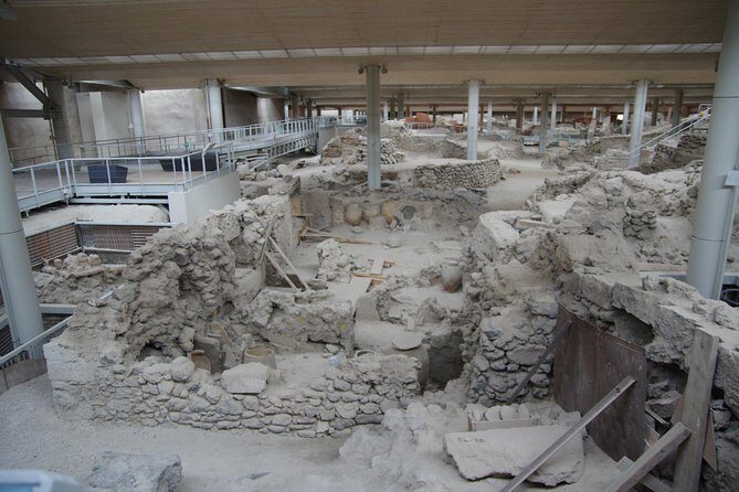 Archaeological Bus Tour to Akrotiri Excavations & Red Beach - Perissa black-sand beach: swimming time and an easy finish