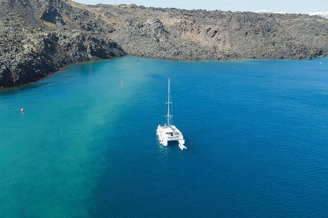 Best of Santorini Private Half-Day Catamaran Cruise with transfer and meal - Red Beach and White Beach: volcanic color, real swimming, and photo contrast