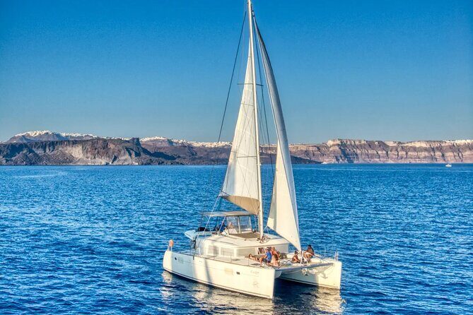 Deluxe Santorini Sailing with BBQ and Drinks Shared Tour - Sailing past the Old Venetian Lighthouse and the Indian Head Mountain