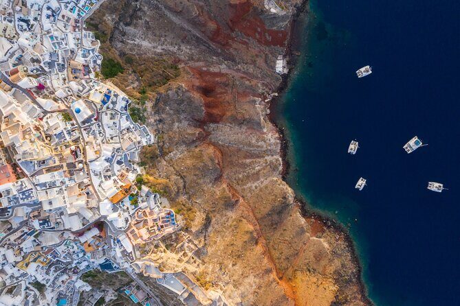 Experience Santorini Sunset by Helicopter - Flying over Fira: the cliffside capital in one clean view