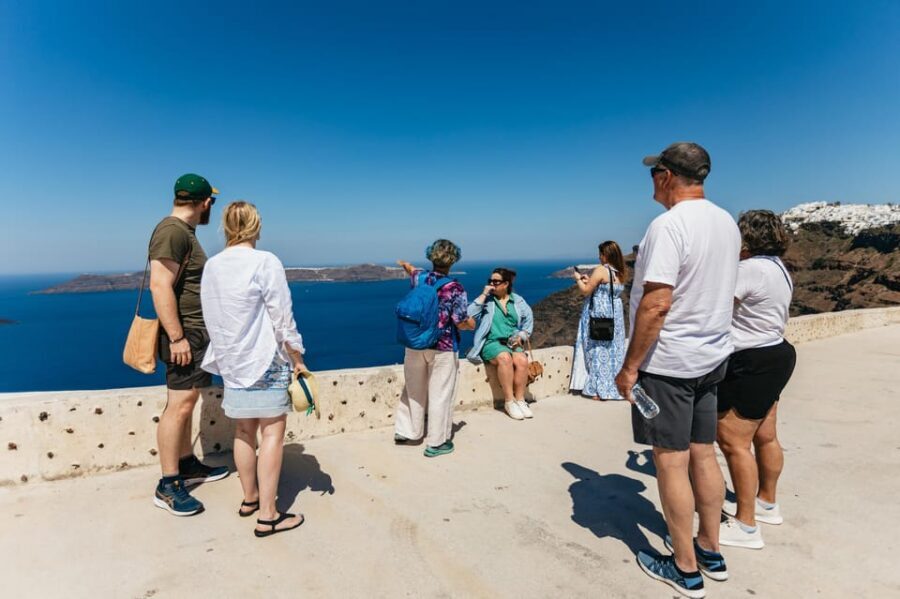 Fira: Guided Foodie Walking Tour with Tastings - Market mornings and a caldera-view midday taverna