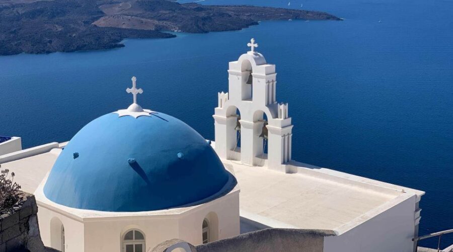 Fira: Walking Tour with Cable Car Ride - The blue-domed direction: Firostefani framing and caldera edge moments