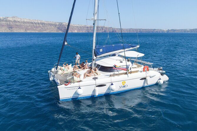 Full Day Santorini Catamaran Private Cruise with meal and transfer - Red Beach and White Beach: volcanic color, short time ashore, big payoff from the deck