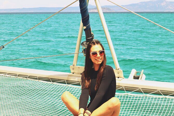 Full Day Santorini Catamaran Private Cruise with meal and transfer - Faros lighthouse and the caldera islands: where the scenery gets weird in the best way