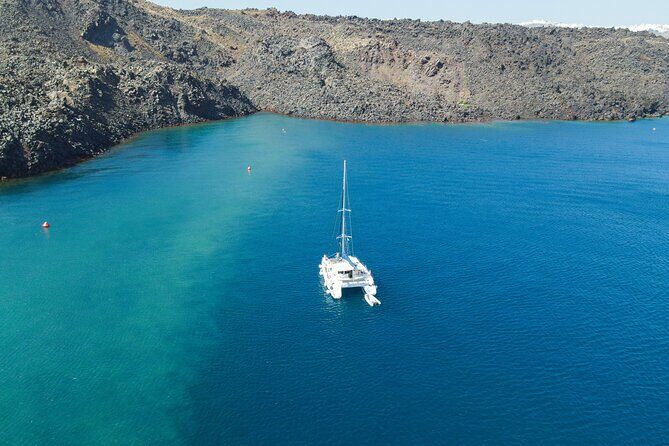 Full Day Santorini Catamaran Private Cruise with meal and transfer - Oia and Fira: quick town time from the sea, not a full-day hike