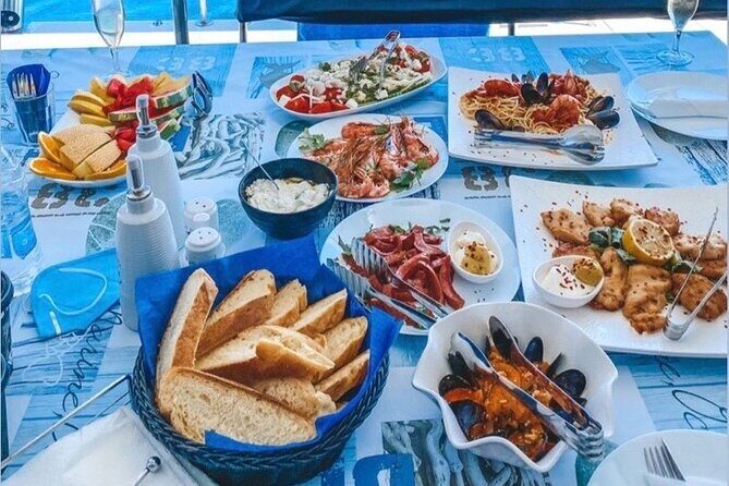 Half-Day Exclusive Catamaran Cruise in Santorini with Meal and Open Bar - The Open Bar and Onboard BBQ: Good Value, Real Social Energy