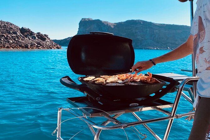 Half-Day Exclusive Catamaran Cruise in Santorini with Meal and Open Bar - Hot Springs by the Volcano: Warm Water, Not a Spa Marinated in Heat
