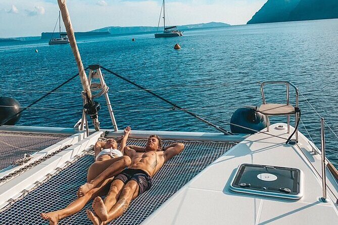 Half Day Premium Catamaran Cruise in Santorini including Oia - The limestone-and-clear-water stop: brief, photo-worthy water