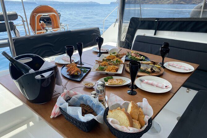 Half Day Premium Catamaran Cruise in Santorini including Oia - Oia from the sea, plus the Venetian lighthouse passing