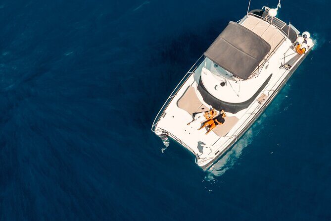 Private Caldera Cruise with Power Catamaran ENJOY incl. Meal & Drinks - The ENJOY power catamaran setup: comfort, privacy, and speed