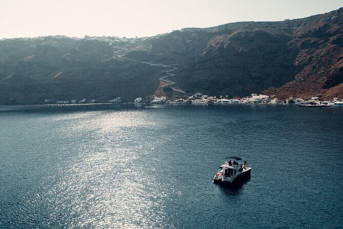 Private Caldera Cruise with Power Catamaran ENJOY incl. Meal & Drinks - Stop 1: Santorini Volcano and hot springs swim (about 30 minutes)