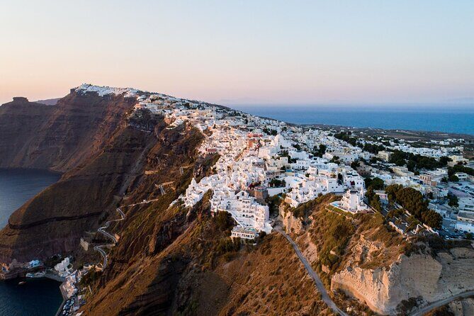 Private Sightseeing Tour with Dinner at Sunset - Perissa Black Sand Beach: the volcanic reset before dinner