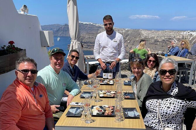 Private Wine Tour in 3 Wineries with 12 Wine Tastings and Tapas - Stop 3 at Venetsanos: Gravity-Fed Wine and Caldera Sunset Views