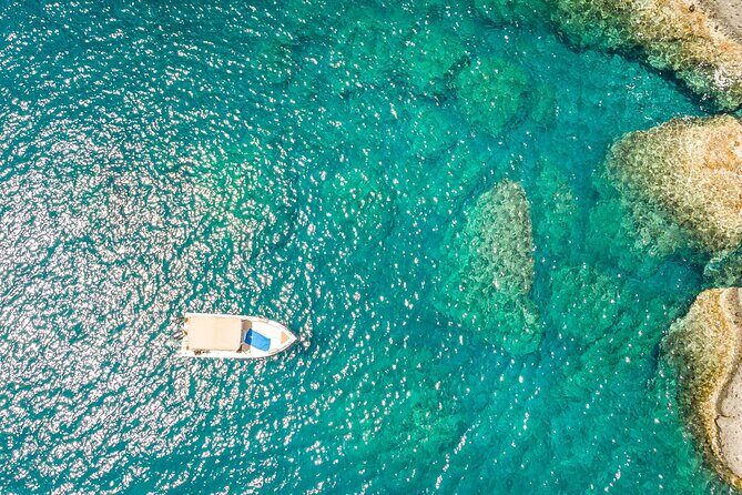 Rent a Boat in Santorini with Free License - Vlichada boat setup: GPS plotter, tracker, ladder, canopy