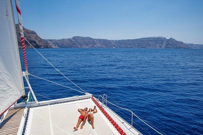 Sailing Catamaran Cruise in Santorini with BBQ, Drinks and Transfer - Hot Springs Stop: Warm Water, Secure Swimming, and Sulfur-Bloom Views