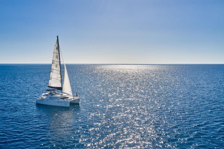 Santorini: Caldera Classic Catamaran Cruise w/ Meal & Drinks - Sailing Past Indian Face Mountain and Akrotiri Lighthouse
