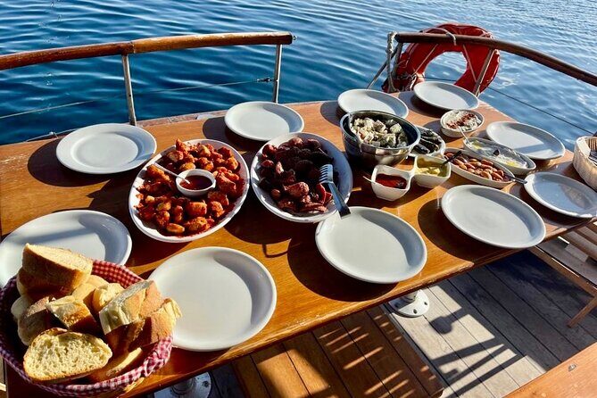 Santorini Caldera Day Traditional Cruise with Meal and Drinks - Red Beach: the color stop you’ll actually swim from