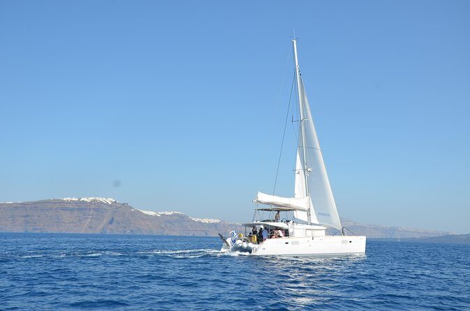 Santorini Caldera Gold Day Cruise with BBQ on board and Open Bar - Sailing By Akrotiri’s Venetian Lighthouse and the Black Mountain Area