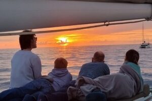 Santorini Caldera Panorama Winter Cruise All Inclusive - The black-coast sail: Mesa Pigadia and volcano-ring views