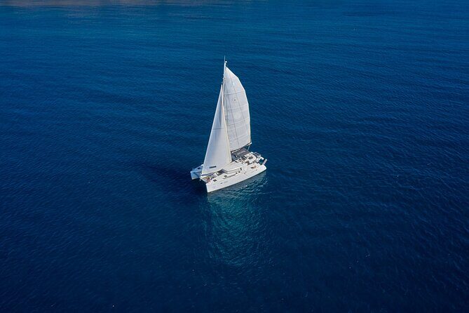 Santorini: Caldera Private Catamaran Cruise with Meal & Drinks - Stop 2: Mesa Pigadia Beach—secluded feel, black-sand look