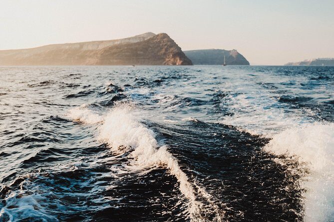 Santorini Caldera Sunset Traditional Cruise with Meal and Drinks - Thirassia snorkeling and lunch: the stop that sets the tone