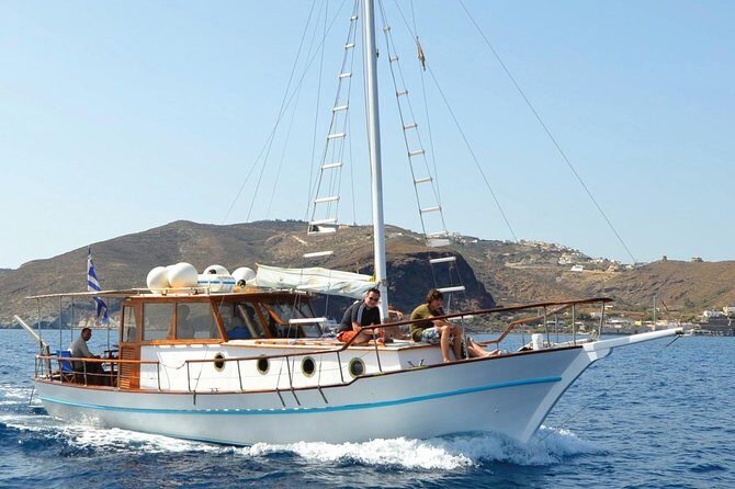 Santorini Caldera Sunset Traditional Cruise with Meal and Drinks - Mesa Pigadia, Akrotiri lighthouse, and the pass-through moments