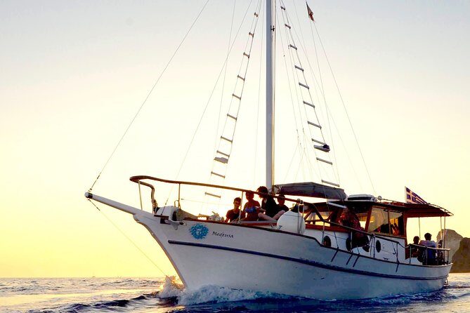 Santorini Caldera Sunset Traditional Cruise with Meal and Drinks - White Beach and Red Beach: the boat-only color show
