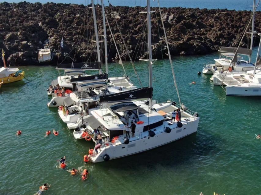 Santorini: Catamaran Cruise with Meal & Open Bar - Food, music, and the crew energy (Mika, Giannis, Kostas, and more)