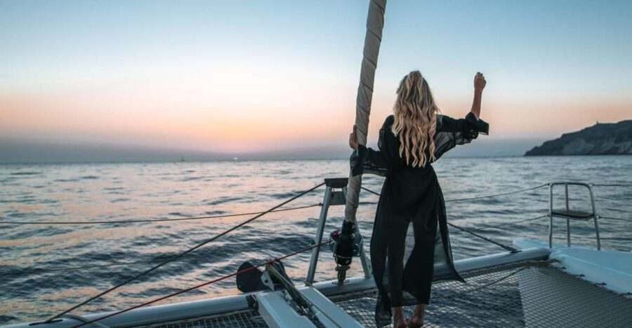 Santorini: Catamaran Cruise with Meal & Open Bar - Sailing past the lighthouse areas and those signature “wow” passes