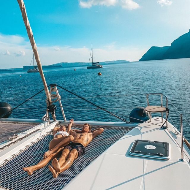 Santorini: Catamaran Cruise with Meal & Open Bar - Volcano sightseeing and the Black Beach photo moment