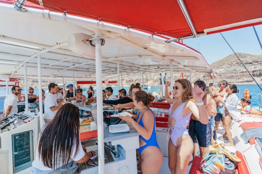 Santorini: Catamaran Tour with BBQ Dinner, Drinks, and Music - Red Beach and White Beach Swimming: What It Means That You Can’t Dock