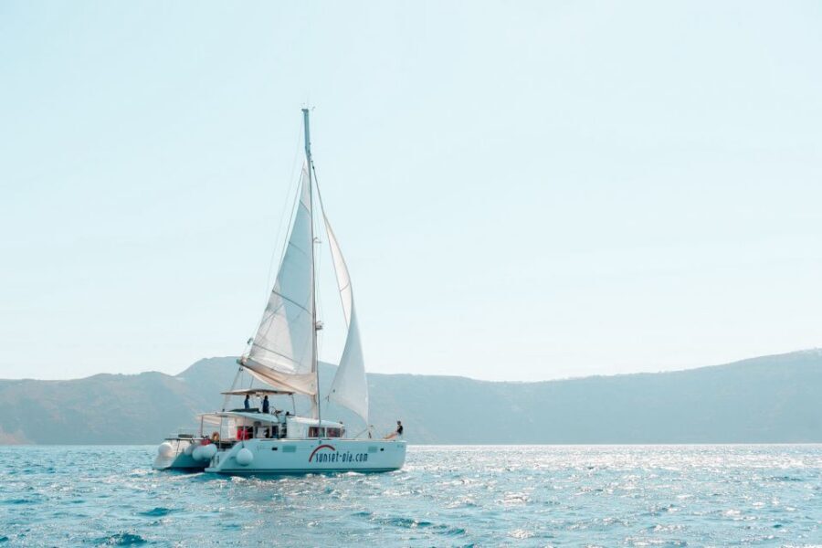 Santorini: Catamaran Tour with BBQ Meal and Unlimited Drinks - Weather reality check: wind, choppy water, and staying warm