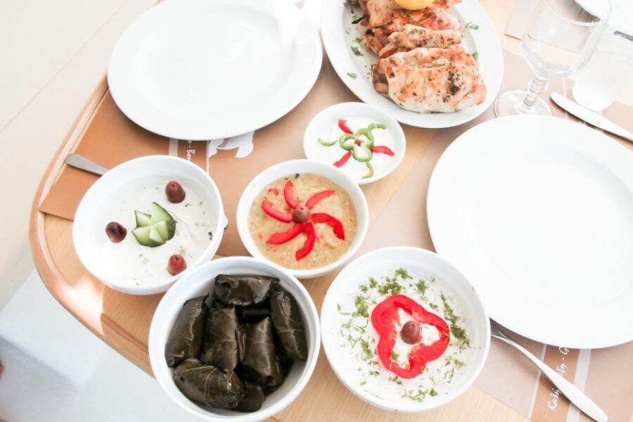 Santorini: Catamaran Tour with BBQ Meal and Unlimited Drinks - The best photo moments: Aspronisi, the lighthouse, Akrotiri, and Indian Rock
