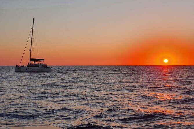 Santorini Classic Catamaran Cruise with BBQ, Drinks and Transfers - Red Beach and White Beach: Gorgeous Views, No Swimming