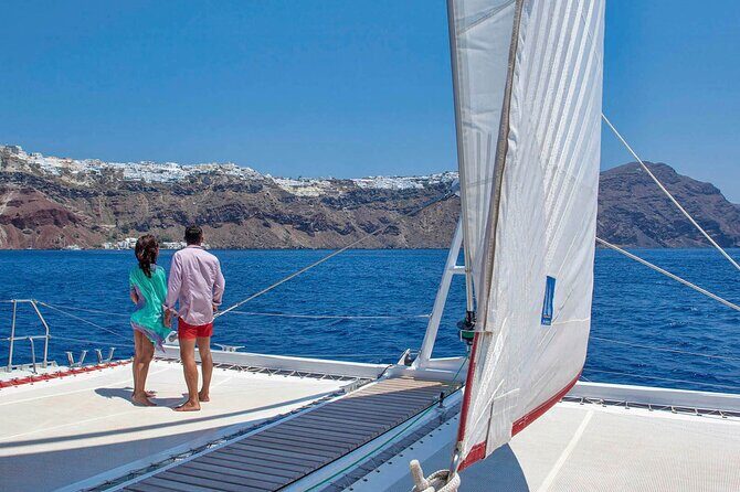 Santorini Cruise on Catamaran with BBQ & Open Bar - Volcano hot springs: black rocks, sulfur water, and close-up snorkeling