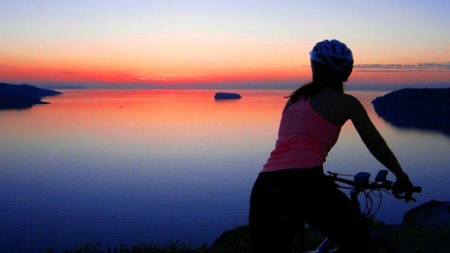 Santorini: Electric Mountain Bike Adventure - Caldera cliff view and the cave chapel in volcanic ash