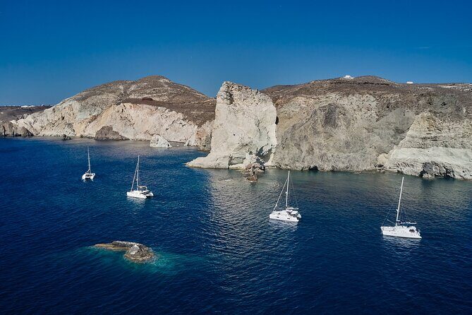 Santorini: Luxury Catamaran Cruise with Fresh Fish BBQ & Drinks - Mesa Pigadia’s black sands and clear water time