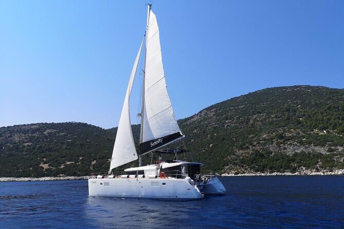 Santorini: Luxury Catamaran Cruise with Fresh Fish BBQ & Drinks - The volcano zone: sulfur waters and black-rock wonder