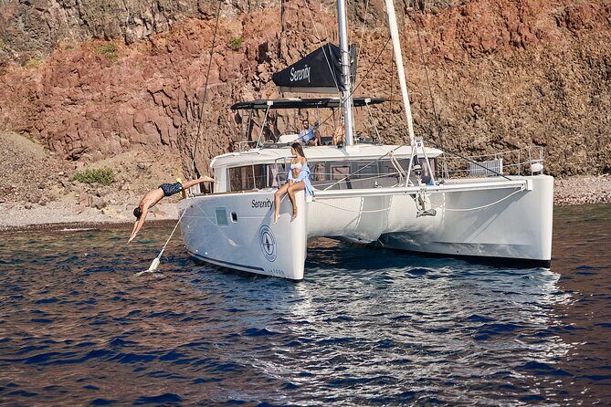 Santorini: Luxury Catamaran Cruise with Fresh Fish BBQ & Drinks - Nea Kameni: the longest swim and the onboard dinner moment