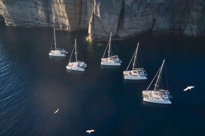 Santorini: Luxury Catamaran Cruise with Fresh Fish BBQ & Drinks - Pickup, timing, and why one late connection can ruin everything