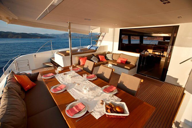 Santorini Luxury Catamaran Day Cruise with BBQ,drinks,transfer - Red Beach stop: shorter swim, big scenery payoff