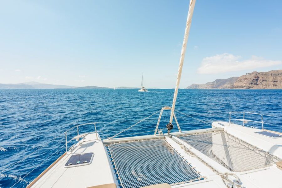 Santorini: Luxury Catamaran Day Trip with Meal and Open Bar - Red Beach stop: quick views, clear water time, easy logistics