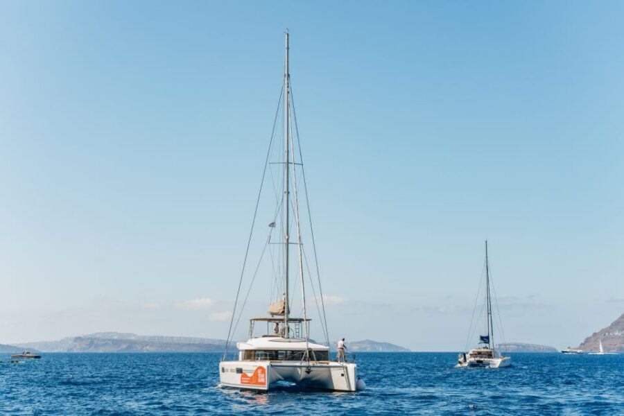 Santorini: Luxury Catamaran Day Trip with Meal and Open Bar - Pickup, boat comfort, and what “small group” really means