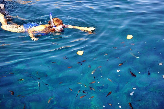 Santorini Luxury Catamaran Sunset Cruise with BBQ, Drink and Transfer - Red Beach snorkeling: short stop, dramatic color, good photo fuel