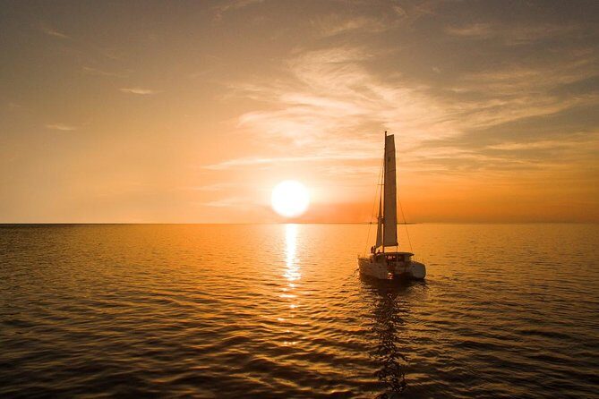 Santorini Luxury Catamaran Sunset Cruise with BBQ, Drink and Transfer - Group size, sailing style, and the real value of the price