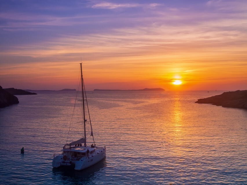 Santorini: Luxury Sunset Cruise with Dinner, BBQ, and Drinks - Sailing past Red Beach, White Beach, and Akrotiri Lighthouse