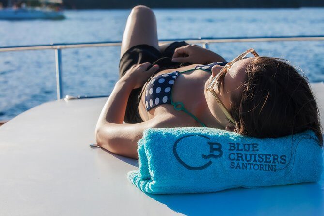 Santorini: Motor Yacht Sunset Cruise with 5-Course Dinner - Cruising the Coast: Red and White Beaches to Akrotiri Lighthouse