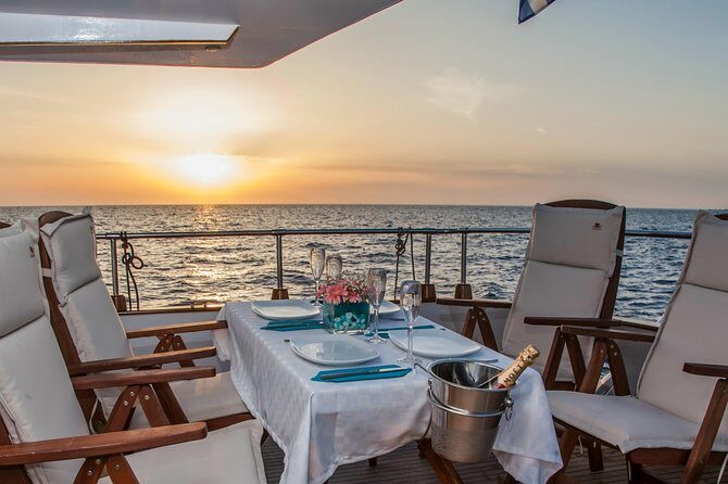 Santorini: Motor Yacht Sunset Cruise with 5-Course Dinner - The 5-Course Dinner and Drinks: What to Expect on Board