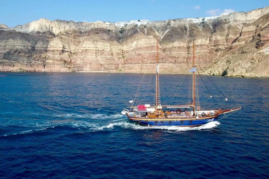 Santorini: Mythical Day Trip to Akrotiri with Volcano Cruise - The volcano cruise by wooden boat: views you can’t get from land