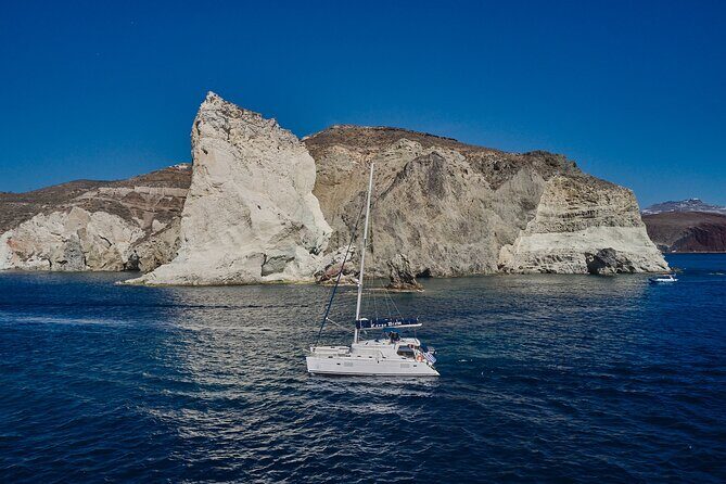 Santorini Oia: Luxury Sunset Cruise with Fresh Fish BBQ & Drinks - Entering The Santorini loop: what makes this cruise feel special